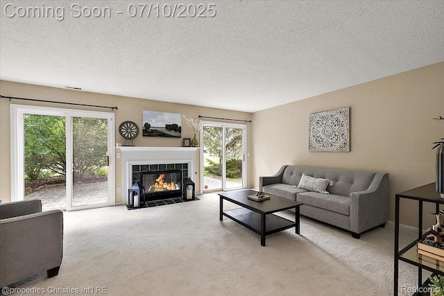 6873 Fox Ln, Waterford, MI 48327 - living area with carpet, a tiled fireplace, and a textured ceiling