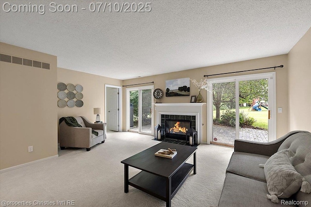 6873 Fox Ln, Waterford, MI 48327 - carpeted living room featuring a tiled fireplace and a textured ceiling