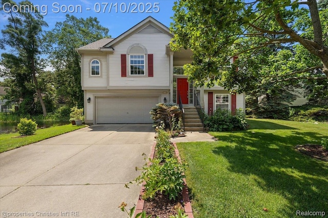 6873 Fox Ln, Waterford, MI 48327 - split foyer home with concrete driveway, a garage, and a front lawn