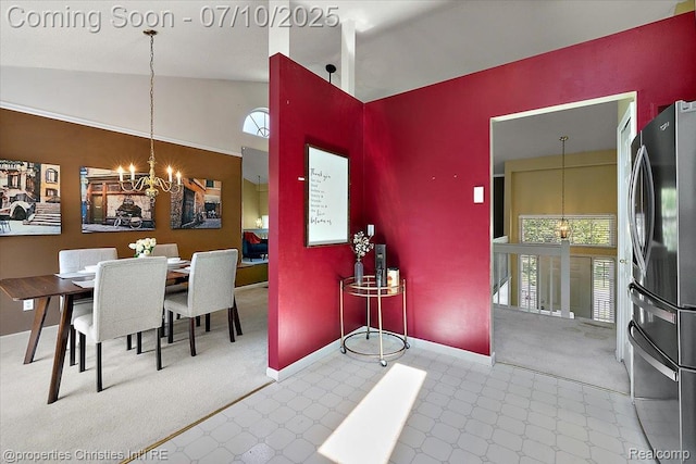 6873 Fox Ln, Waterford, MI 48327 - carpeted dining space with a chandelier and high vaulted ceiling