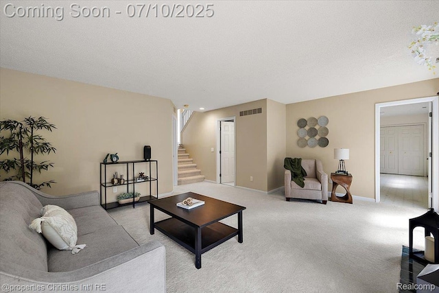 6873 Fox Ln, Waterford, MI 48327 - living area with stairs, light carpet, and a textured ceiling