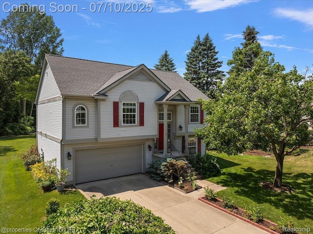 6873 Fox Ln, Waterford, MI 48327 - raised ranch with a garage, driveway, a front yard, and roof with shingles