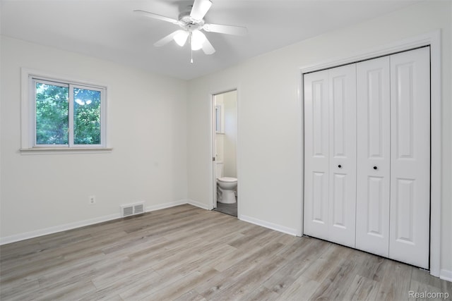21710 Whitmore St, Oak Park, MI 48237 - unfurnished bedroom with light wood-type flooring, a closet, connected bathroom, and a ceiling fan