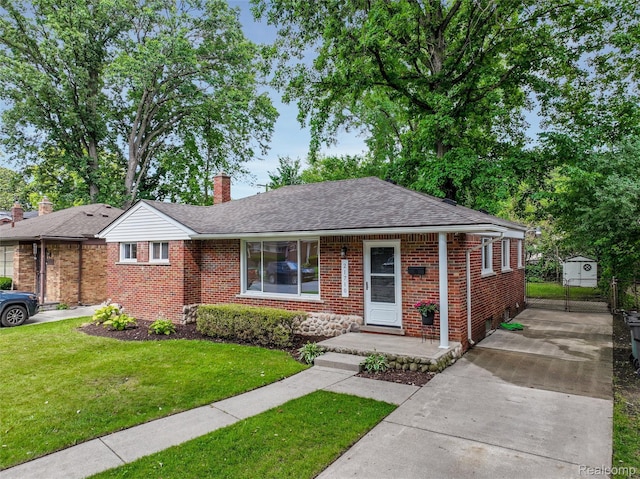 21710 Whitmore St, Oak Park, MI 48237 - view of front facade featuring brick siding, concrete driveway, a front lawn, and roof with shingles