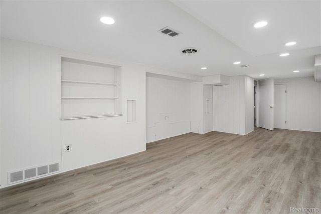 21710 Whitmore St, Oak Park, MI 48237 - below grade area featuring light wood-style floors, built in shelves, and recessed lighting