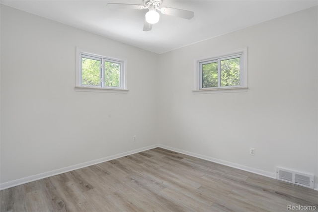 21710 Whitmore St, Oak Park, MI 48237 - spare room featuring healthy amount of natural light, light wood-style floors, and a ceiling fan
