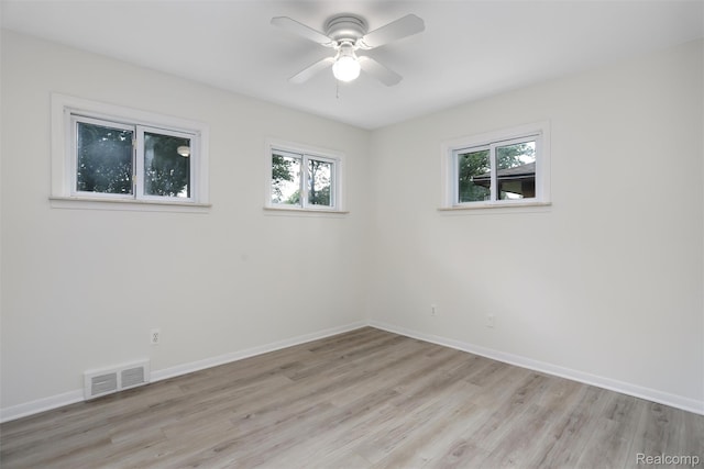 21710 Whitmore St, Oak Park, MI 48237 - spare room featuring healthy amount of natural light, light wood-type flooring, and a ceiling fan