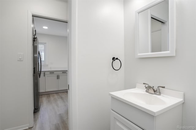 21710 Whitmore St, Oak Park, MI 48237 - bathroom featuring vanity and wood finished floors