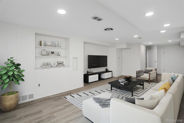 21710 Whitmore St, Oak Park, MI 48237 - living room featuring light wood-style floors, recessed lighting, and built in features