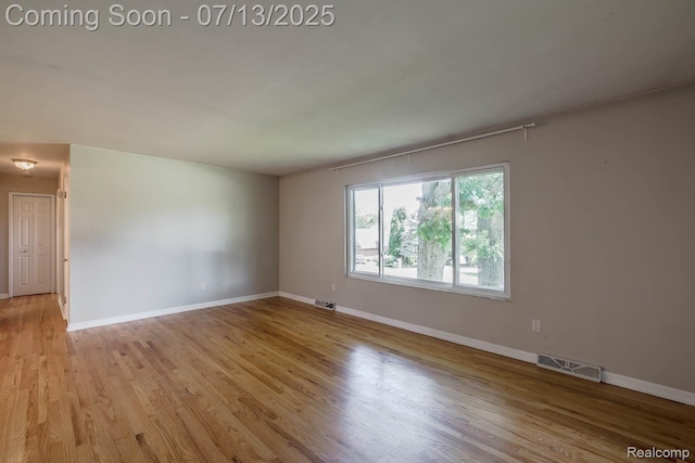 7709 Shelley Dr, Clarkston, MI 48348 - unfurnished room featuring light wood-style floors and baseboards