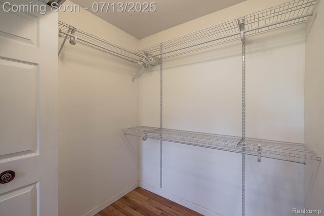 7709 Shelley Dr, Clarkston, MI 48348 - walk in closet with wood finished floors