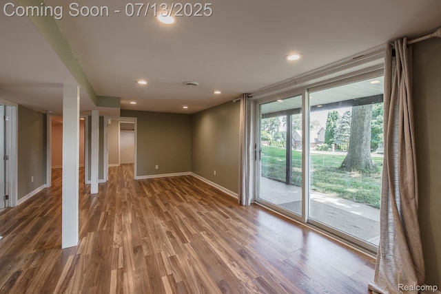 7709 Shelley Dr, Clarkston, MI 48348 - spare room featuring wood finished floors and recessed lighting