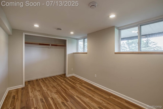 7709 Shelley Dr, Clarkston, MI 48348 - unfurnished bedroom with a closet, wood finished floors, and recessed lighting