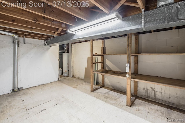 7709 Shelley Dr, Clarkston, MI 48348 - unfinished basement with water heater and tile patterned floors