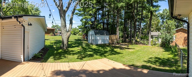 7709 Shelley Dr, Clarkston, MI 48348 - view of yard featuring a storage unit and a deck