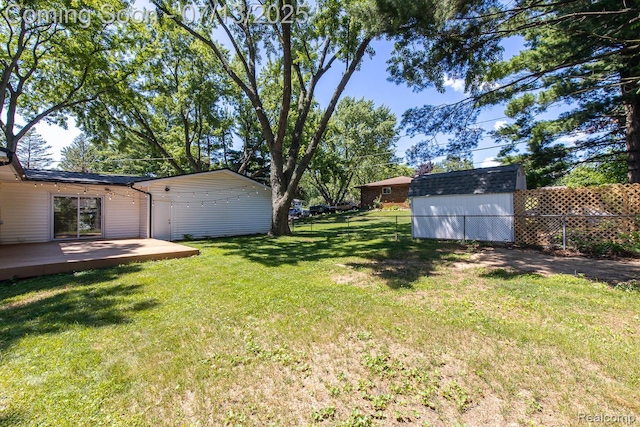 7709 Shelley Dr, Clarkston, MI 48348 - view of yard with a storage unit and a wooden deck