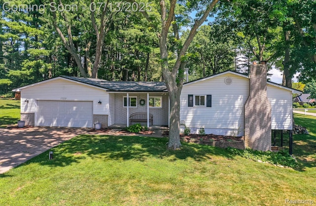 7709 Shelley Dr, Clarkston, MI 48348 - ranch-style home with a garage, concrete driveway, a chimney, and a front lawn