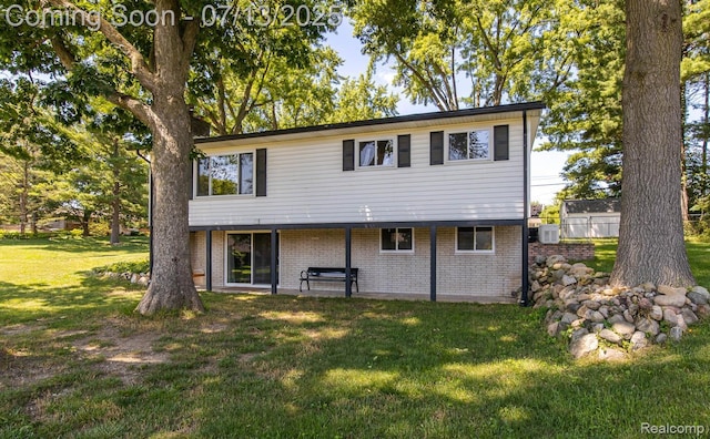 7709 Shelley Dr, Clarkston, MI 48348 - view of front facade featuring a front yard and brick siding