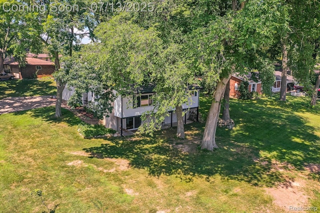 7709 Shelley Dr, Clarkston, MI 48348 - view of grassy yard featuring driveway