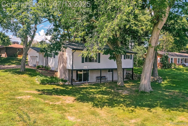 7709 Shelley Dr, Clarkston, MI 48348 - back of house with a garage, a lawn, a patio area, and brick siding