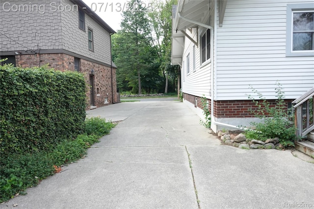 341 W Oakridge St W, Ferndale, MI 48220 - view of property exterior featuring driveway and brick siding