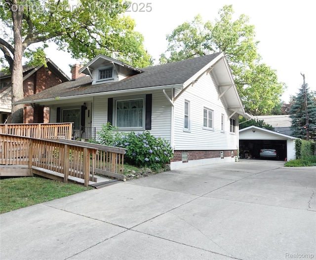 341 W Oakridge St W, Ferndale, MI 48220 - bungalow featuring driveway, covered porch, an outbuilding, a chimney, and a detached carport