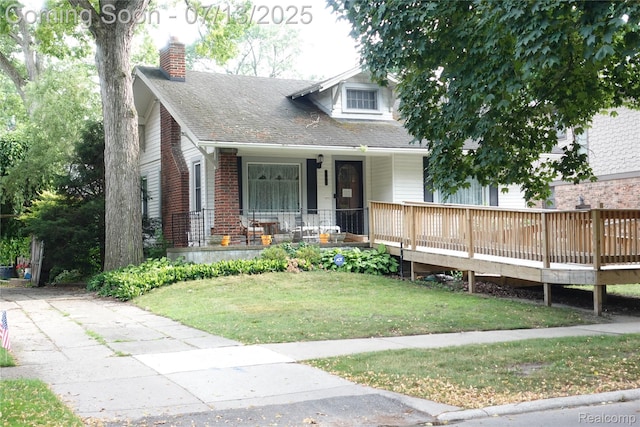 341 W Oakridge St W, Ferndale, MI 48220 - view of front of home featuring a chimney, a porch, a front lawn, and roof with shingles