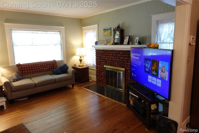341 W Oakridge St W, Ferndale, MI 48220 - living area with wood finished floors, ornamental molding, and a brick fireplace