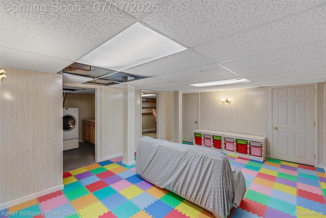 1046 Stonehenge Rd, Flint, MI 48532 - rec room with washer / clothes dryer, tile patterned floors, and a drop ceiling