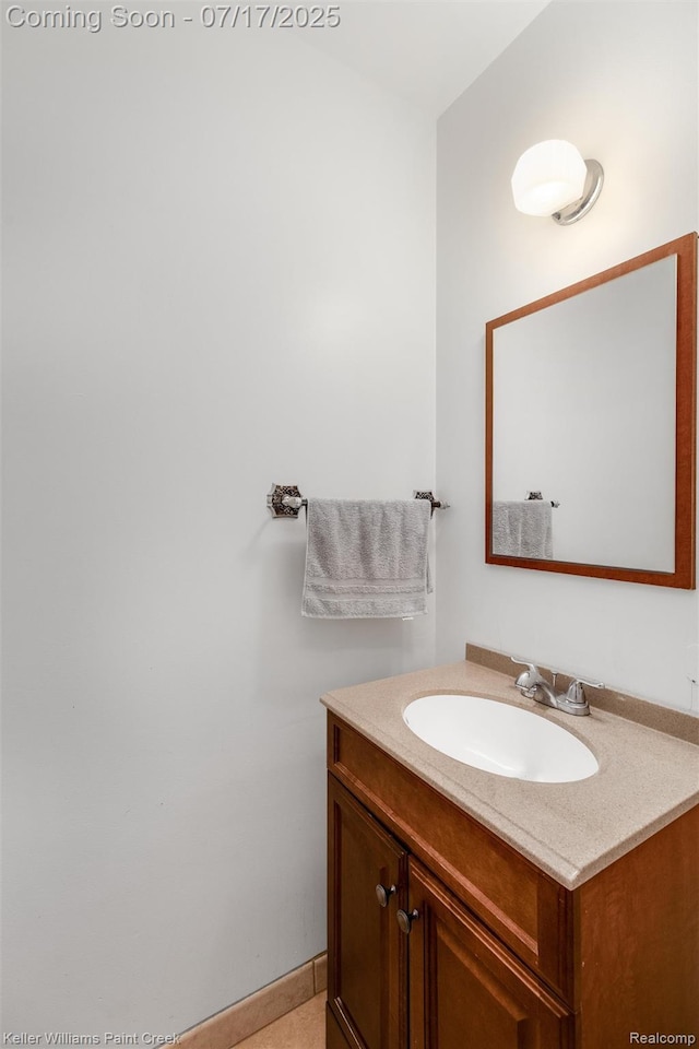 1046 Stonehenge Rd, Flint, MI 48532 - bathroom with vanity and baseboards