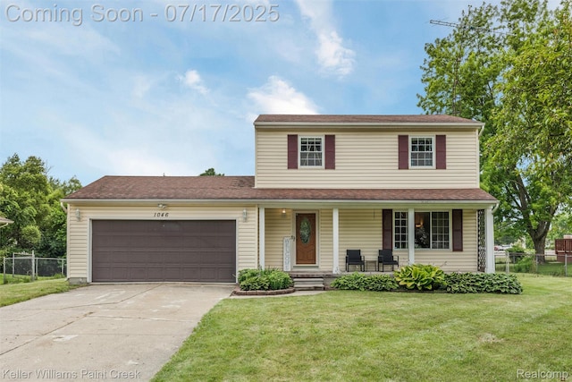 1046 Stonehenge Rd, Flint, MI 48532 - view of front of home with concrete driveway, an attached garage, and a porch