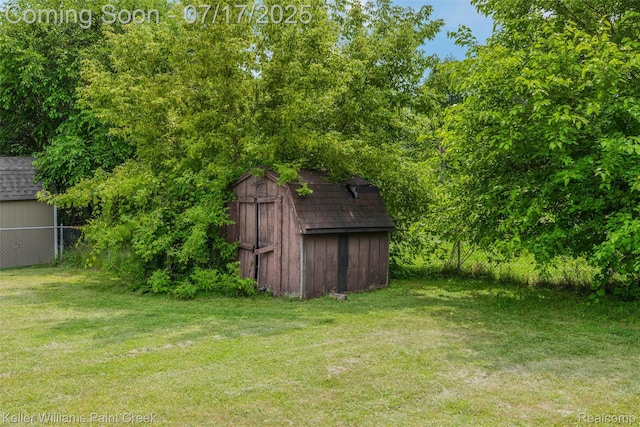 1046 Stonehenge Rd, Flint, MI 48532 - view of yard with a storage shed