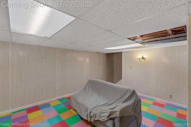 1046 Stonehenge Rd, Flint, MI 48532 - playroom featuring a drop ceiling and tile patterned floors