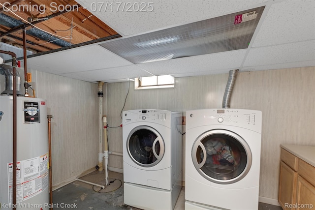 1046 Stonehenge Rd, Flint, MI 48532 - laundry area featuring water heater and separate washer and dryer