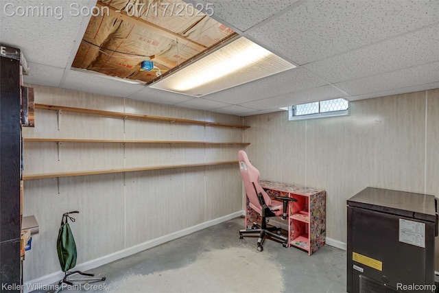1046 Stonehenge Rd, Flint, MI 48532 - below grade area featuring a paneled ceiling and fridge