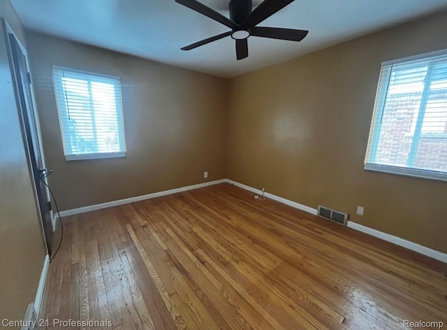 15451 Prest St, Detroit, MI 48227 - spare room with hardwood / wood-style floors and a ceiling fan