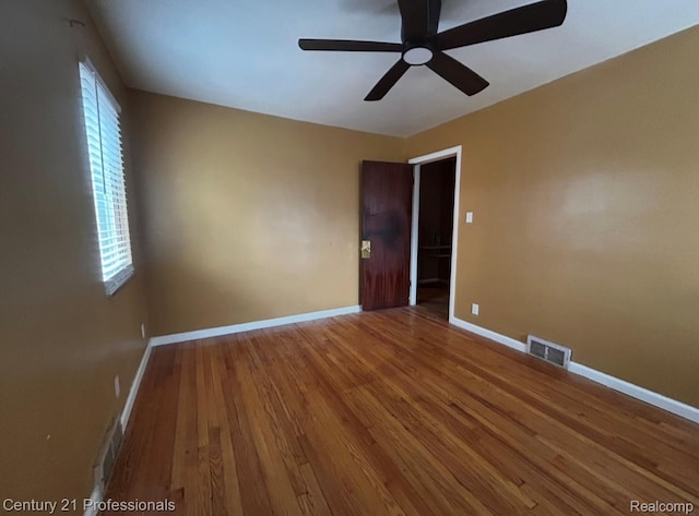 15451 Prest St, Detroit, MI 48227 - spare room featuring wood finished floors and a ceiling fan