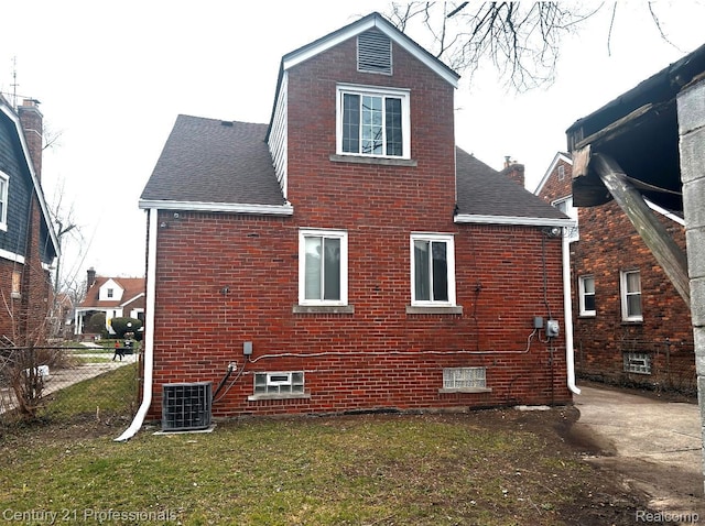 15451 Prest St, Detroit, MI 48227 - view of side of property featuring a shingled roof, brick siding, and a chimney