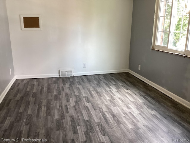 15451 Prest St, Detroit, MI 48227 - unfurnished room featuring baseboards and dark wood-type flooring