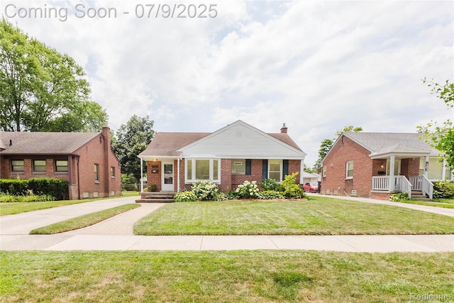 437 Normandy Rd, Royal Oak, MI 48073 - bungalow-style home featuring brick siding, a front yard, a chimney, and a porch