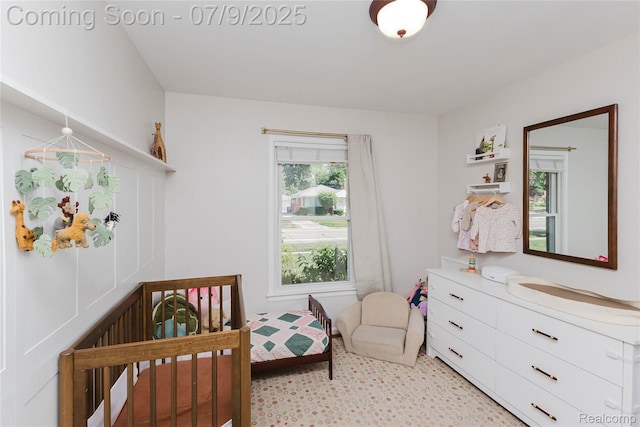 437 Normandy Rd, Royal Oak, MI 48073 - bedroom featuring a crib and light carpet
