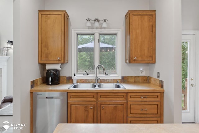 7266 Dodge Rd, Montrose, MI 48457 - kitchen featuring dishwasher, light countertops, and brown cabinetry