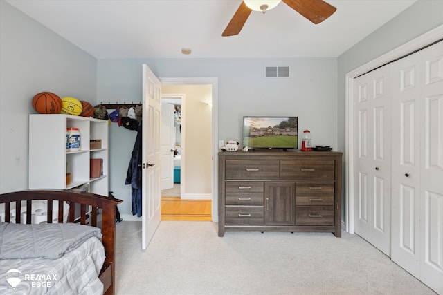 7266 Dodge Rd, Montrose, MI 48457 - bedroom with light colored carpet, a closet, and ceiling fan