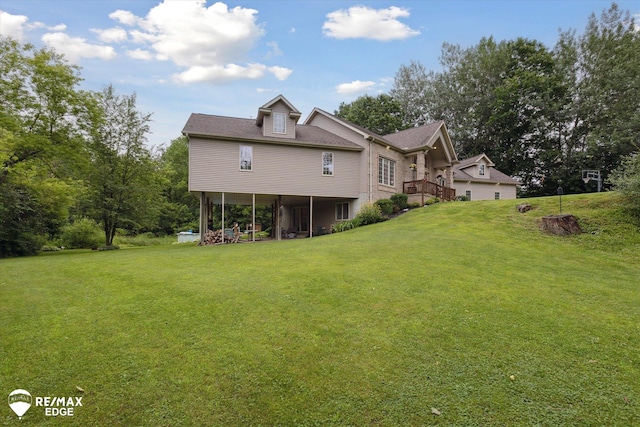 7266 Dodge Rd, Montrose, MI 48457 - rear view of house featuring a yard