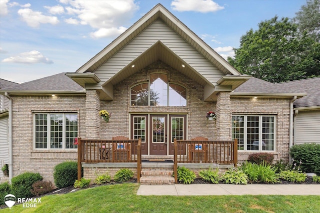 7266 Dodge Rd, Montrose, MI 48457 - rear view of property with brick siding, roof with shingles, and a deck