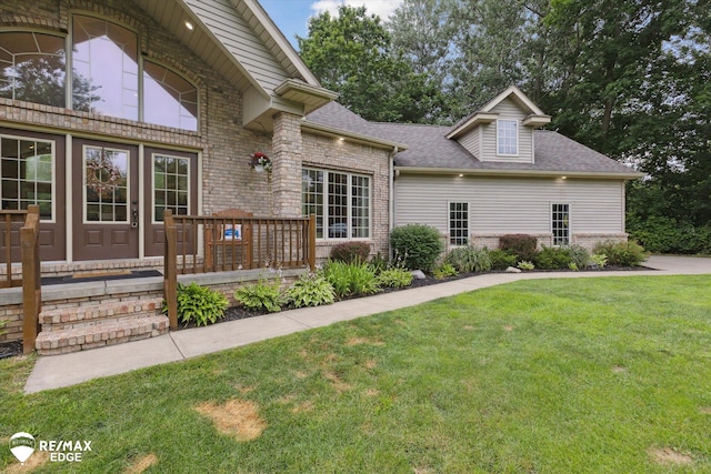 7266 Dodge Rd, Montrose, MI 48457 - view of front of property featuring a front lawn, brick siding, and roof with shingles