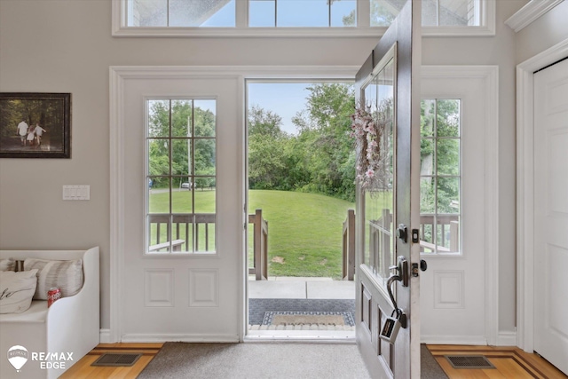 7266 Dodge Rd, Montrose, MI 48457 - doorway with french doors, healthy amount of natural light, and wood finished floors