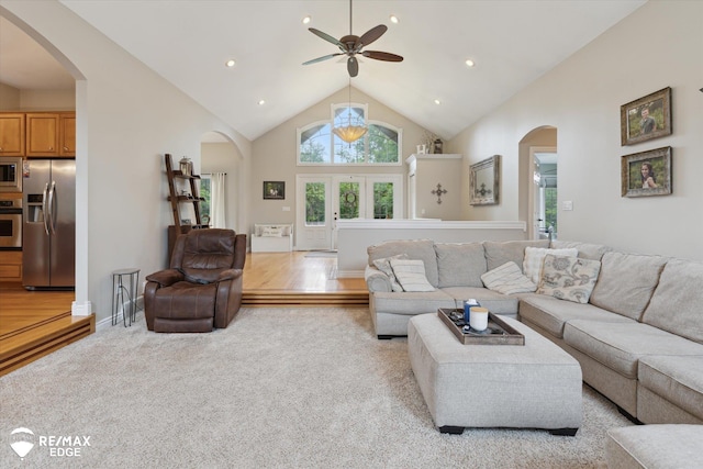 7266 Dodge Rd, Montrose, MI 48457 - living room with arched walkways, high vaulted ceiling, light colored carpet, a ceiling fan, and recessed lighting