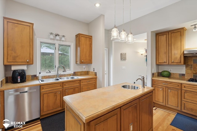 7266 Dodge Rd, Montrose, MI 48457 - kitchen featuring stainless steel dishwasher, brown cabinetry, light countertops, light wood-type flooring, and recessed lighting