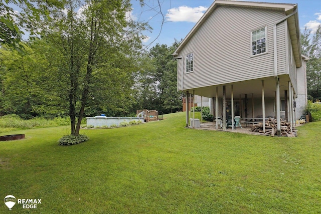 7266 Dodge Rd, Montrose, MI 48457 - view of grassy yard featuring a patio area
